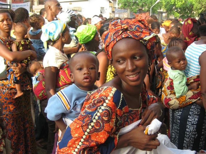 This mother and baby in Sierra Leone are among hundreds waiting in line at 8am for a children's hospital to open.